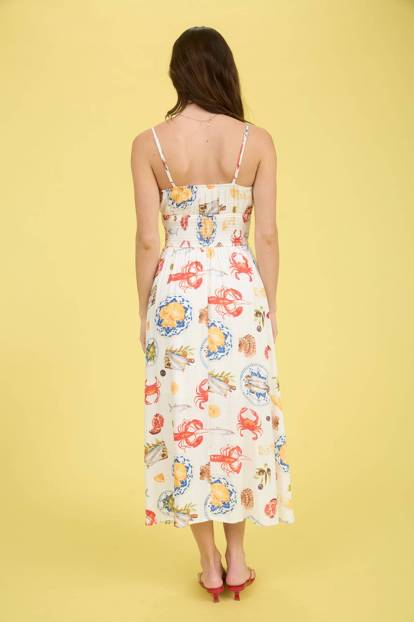 Back of Smocked Midi Dress with Seaside Pattern. Spaghetti straps.