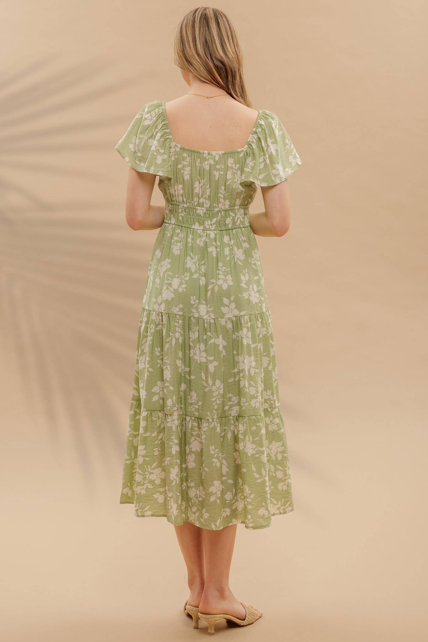 Back of light green midi dress