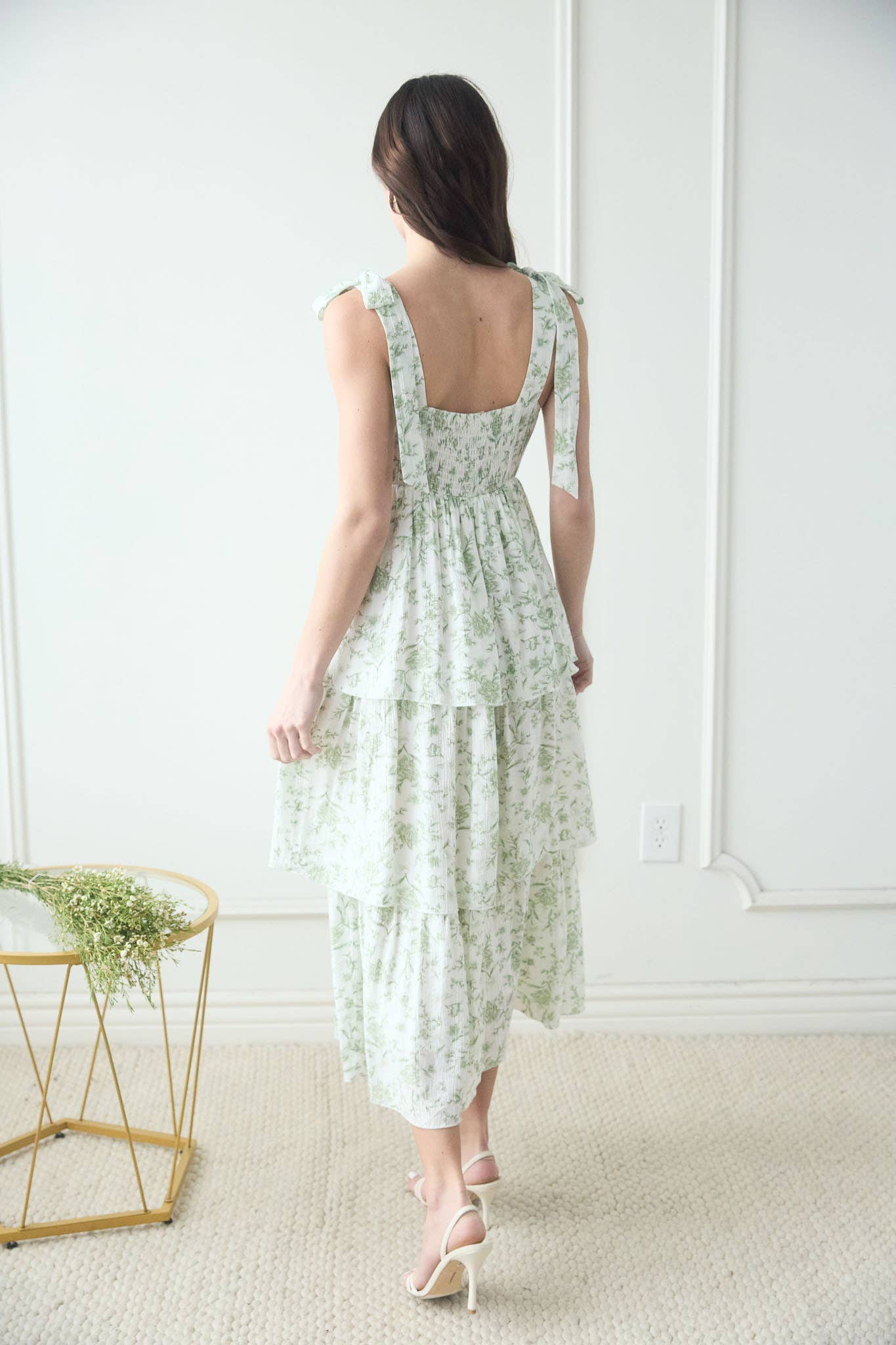 Back of ruffled sage green dress